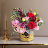 Bold, romantic, and richly textured, this jewel-toned floral arrangement is reimagined in
