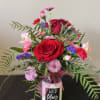 A unique arrangement, placed on top of a candle! The perfect two