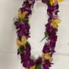 This beautiful lei made with gold yellow cymbidium orchid and purple dendrobium