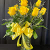 A dozen yellow roses, a timeless symbol of friendship and joy, each
