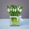 Luxurious and chic, a timeless display of all white fresh tulips arranged