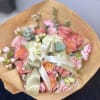 Mix of flowers in stock, wrapped in news paper.