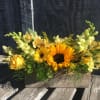 A bright and full beautiful array of yellow and orange flowers in