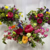 Bursting with vibrant, color and joy, this bright and cheerful bouquet is
