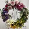 This beautiful wreath is made with a large variety of floral. Send