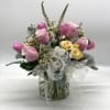 A soft, beautiful mix of fresh hydrangea, roses, spray roses and more