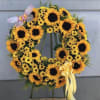Sunflower wreath with pink butterfly approximately 24&rdquo;