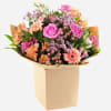 Brighten her special day with this radiant bouquet bursting with warm peach