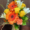 This Beautiful mason jar arrangement filled with Gerberas, roses and lilies! 
