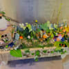 This artificial fairy garden contains multitudes! Examine it closer and find more