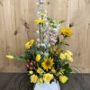 She will love this floral arrangement designed in a handbag! Colors include