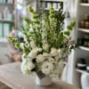 Introducing Treasured Memories, an all-white floral bouquet that whispers elegance and serenity.