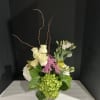 This chic arrangement is exclusive to surprise all special ocassion 
Filled orchidgreensrosesgreen