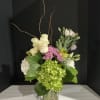 This chic arrangement is exclusive to surprise all special ocassion 
Filled orchidgreensrosesgreen