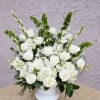 An all white tribute, this funeral basket is pure and tranquil. Featuring