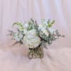 An elegant all-white arrangement that embodies purity and joy. Featuring soft roses