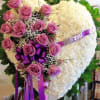 Heart of white carnations with a break of lavender roses.  Available