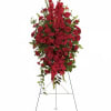 The radiant arrangement includes red roses, red gladioli, red carnations and red