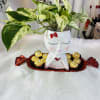 Pretty Lady, it is a pothos plant in a beautiful pot accompanied