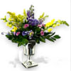 Eternal Grace Memorial Urn arrangement features a graceful blend of snapdragons, solidago