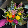 An arrangement of different spring colors with an array of flowers and