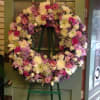 A beautiful and elegant European-style wreath with mixed flowers on an easel.

Picture
