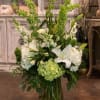 A fresh mix of white green  hydrangeas, bells of Ireland, white