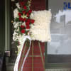 A beautiful floral pillow with assorted white and red flowers.

**Price does not