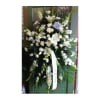 A beautiful standing spray in whites and creams.

**Price does not include printed