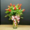 Tickle her with tulips! This elegant bouquet of ten red tulips is