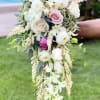 A beautiful cascade-style bridal bouquet, its beautiful and novel shape is the