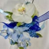 Made from fresh flowers, a corsage looks like a petite flower arrangement