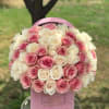 Our signature pink velvet box filled with pink and white roses.