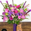 Made of purple, pink, white roses, lilies, and other flowers of lots