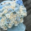 Welcome baby boy arrangement. Full of roses, spray roses, hydrangeas and stock.