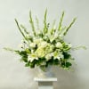 This All White Arrangement Includes Gladiola, Larkspur, Lily, Roses, Hydrangea, Carnations and