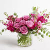 Lavender roses and other seasonal classic florals artfully balanced in Eucalyptus. A