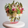 This bouquet captures a delicate balance of winter&#039;s elegance and spring&#039;s awakening.