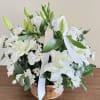This elegant funeral flower basket is a heartfelt tribute, featuring the serene