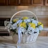 The &quot;Chrysanthemum Bliss Basket&quot; is a delightful arrangement of vibrant chrysanthemums beautifully