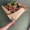 Treat anyone with this bouquet of brown beautiful roses, comes with greenery.