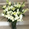 An Elegant tall flower deign with Roses, Hydrangeas, Lilies and other flowers