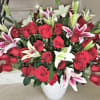 Beautifully arranged with Premium Red Roses with Fragrant Lilies and greenery in