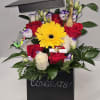 
A graduation bouquet is a celebratory floral arrangement, often used to congratulate