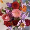 Hand tied pretty bouquet of happy bright colors.
Ranunculus, roses, snapdragons and other