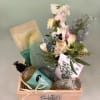 Gorgeous box full of wellness products in mint green and sage colors.