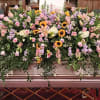 This beautiful full casket cover comes with lavender and pink roses, stock