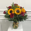 A beautiful combination of sunflowers and roses to brighten someone&#039;s day. 