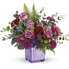 A serene style statement in lush lavender roses and fresh maroon blooms