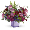 A serene style statement in lush lavender roses and fresh maroon blooms